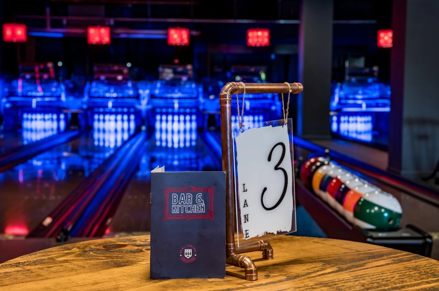 Menu on table with bowling lanes in background